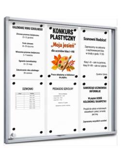 Gablota z przesuwną szybą i okrągłymi narożnikami 6×A4 P408x6 z ogłoszeniami szkoły na magnesach, widok z boku